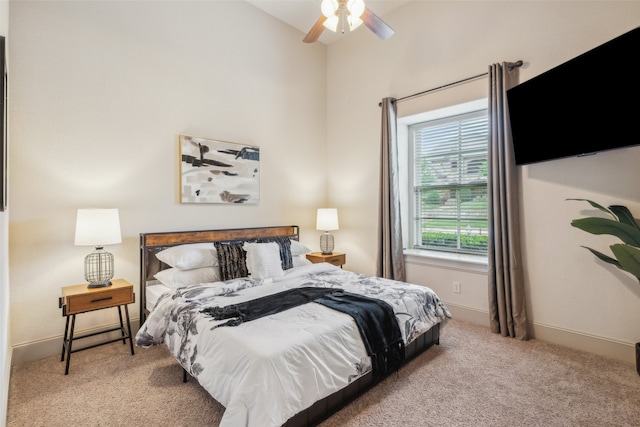 carpeted bedroom featuring baseboards and a ceiling fan