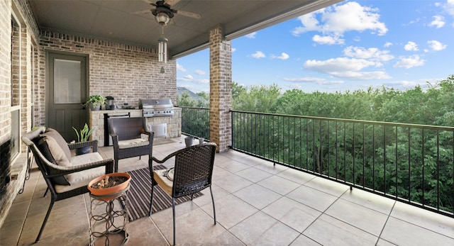 balcony with ceiling fan, exterior kitchen, and grilling area