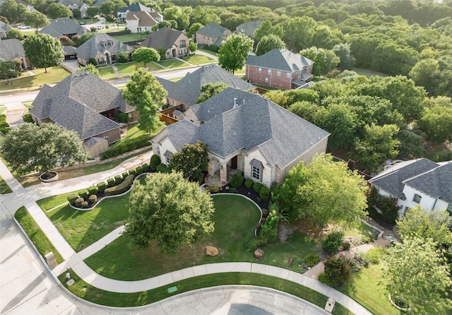 birds eye view of property with a residential view