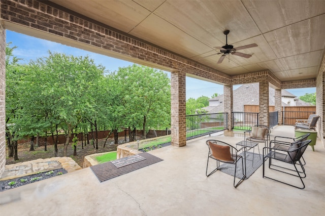view of patio featuring a fenced backyard and ceiling fan