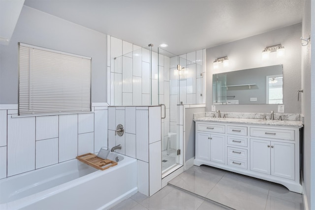 full bath featuring a garden tub, a sink, double vanity, and a stall shower