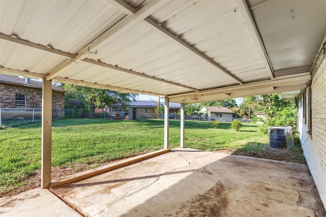 view of patio / terrace with fence, a carport, and central AC unit