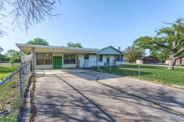 single story home featuring a front lawn, driveway, and a fenced front yard