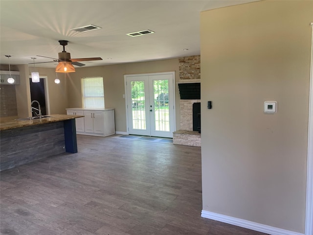 kitchen featuring french doors, dark wood-style flooring, baseboards, visible vents, and white cabinetry