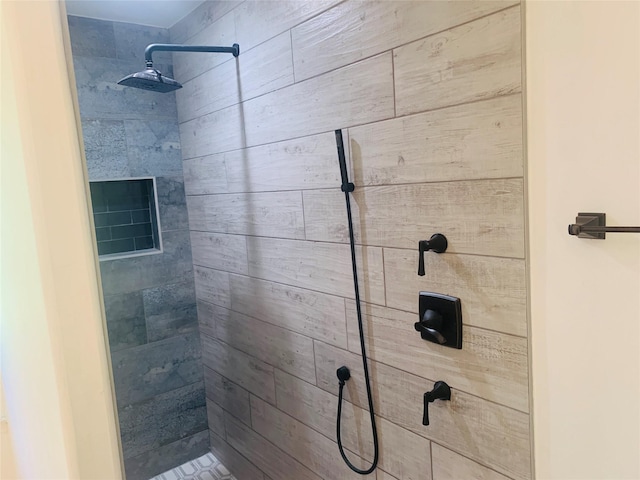 bathroom with tiled shower