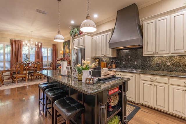 789 Fairmont Dr, Tyler, TX 75701 - kitchen with an inviting chandelier, visible vents, ornamental molding, appliances with stainless steel finishes, and custom exhaust hood