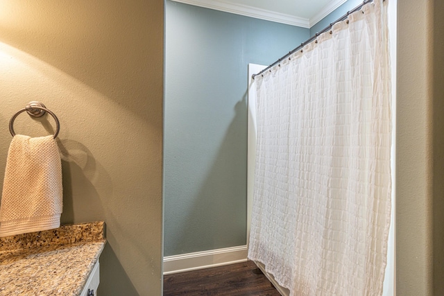 789 Fairmont Dr, Tyler, TX 75701 - full bathroom featuring baseboards, crown molding, wood finished floors, and a shower with shower curtain