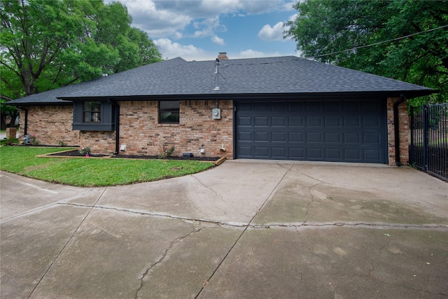 view of front of house with a front lawn, driveway, a garage, brick siding, and roof with shingles