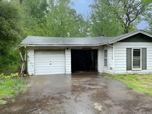 garage featuring driveway