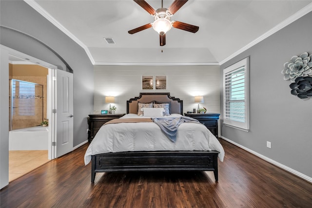 bedroom with a ceiling fan, crown molding, wood finished floors, baseboards, and visible vents