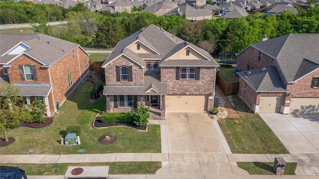 view of front of home with a residential view, roof with shingles, driveway, brick siding, and an attached garage