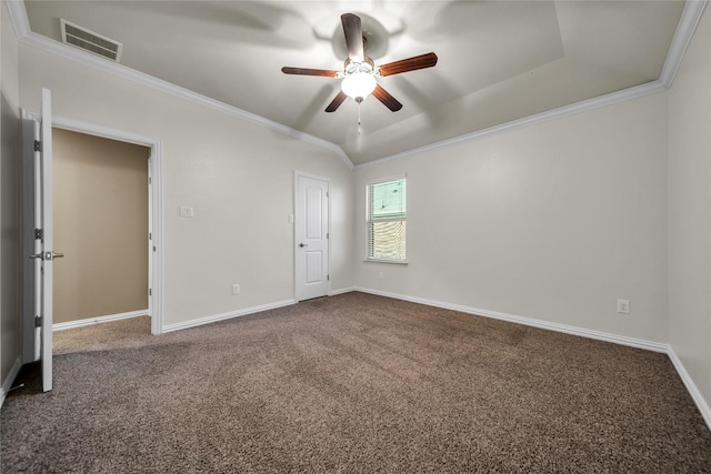 carpeted empty room featuring visible vents, crown molding, baseboards, and ceiling fan