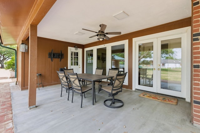 view of patio / terrace with outdoor dining area, a ceiling fan, and french doors