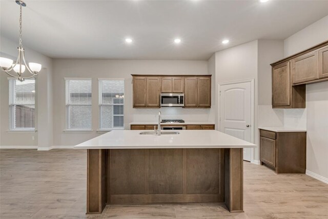 15044 Ted Trl, Aledo, TX 76008 - kitchen featuring a sink, dishwasher, light wood-style flooring, a center island with sink, and recessed lighting