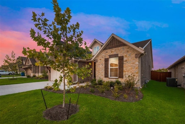 15044 Ted Trl, Aledo, TX 76008 - view of front of home featuring stone siding, concrete driveway, central AC, and an attached garage