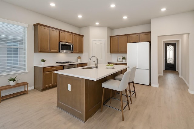 15044 Ted Trl, Aledo, TX 76008 - kitchen with freestanding refrigerator, a sink, stainless steel microwave, an island with sink, and gas stovetop