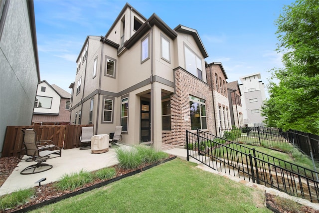 7112 Amber Grove Ct, Dallas, TX 75231 - back of property featuring a fenced backyard, a patio area, stucco siding, and a lawn