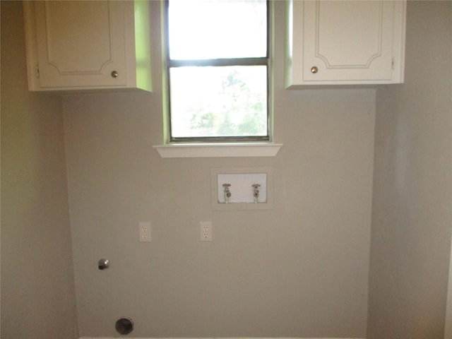 washroom featuring cabinet space, washer hookup, and electric dryer hookup