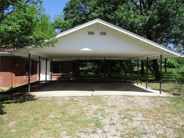 view of parking featuring driveway and a carport