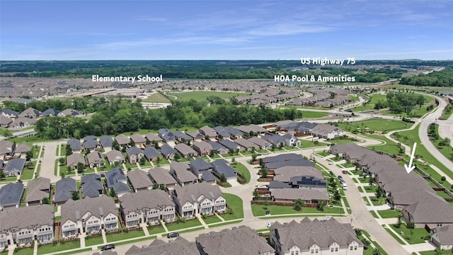 birds eye view of property with a residential view