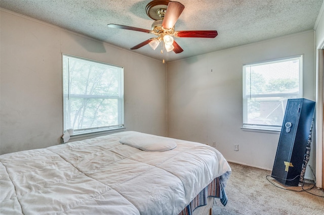 4744 Richard St, Forest Hill, TX 76119 - carpeted bedroom featuring a textured ceiling, ceiling fan, and ornamental molding