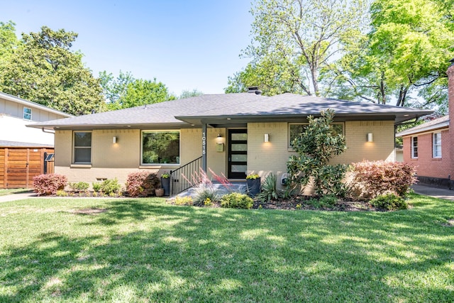 10515 Sinclair Ave, Dallas, TX 75218 - ranch-style house with brick siding, roof with shingles, and a front yard