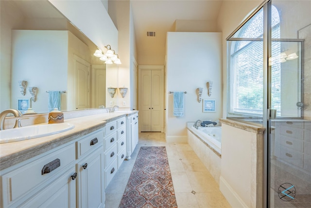 8650 Toler Pt, Larue, TX 75770 - bathroom with plenty of natural light, visible vents, a sink, and double vanity