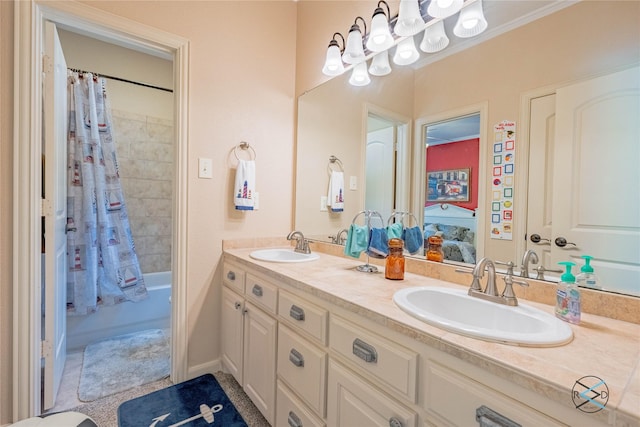 8650 Toler Pt, Larue, TX 75770 - full bath with double vanity, shower / bath combo with shower curtain, ornamental molding, and a sink