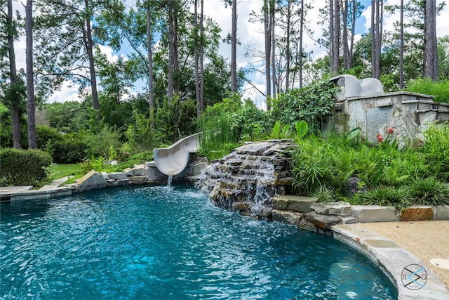 8650 Toler Pt, Larue, TX 75770 - outdoor pool featuring a water slide and a small pond