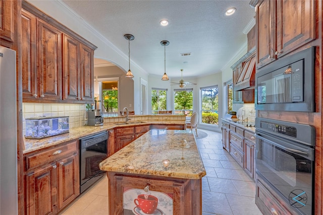 8650 Toler Pt, Larue, TX 75770 - kitchen featuring a sink, black appliances, a peninsula, ornamental molding, and light stone countertops