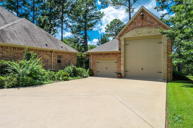 8650 Toler Pt, Larue, TX 75770 - view of front of house featuring brick siding, roof with shingles, and a garage