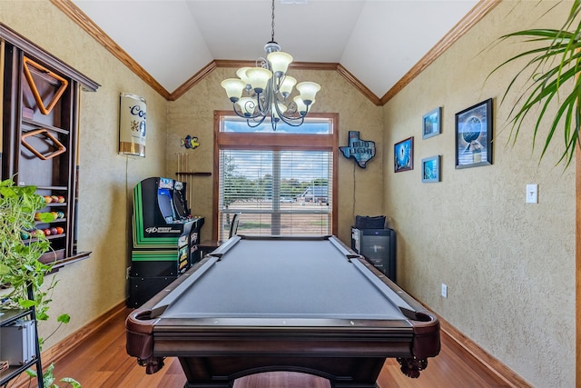 playroom with baseboards, an inviting chandelier, lofted ceiling, wood finished floors, and pool table
