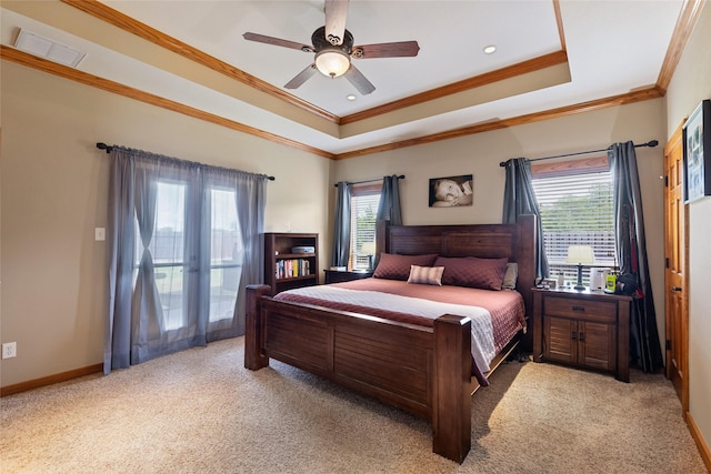 bedroom featuring light carpet, a tray ceiling, access to exterior, visible vents, and crown molding
