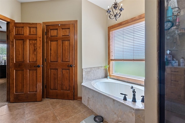 full bathroom with plenty of natural light, a garden tub, tile patterned floors, and a shower with door