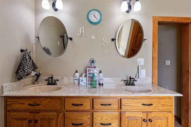 bathroom featuring double vanity and a sink