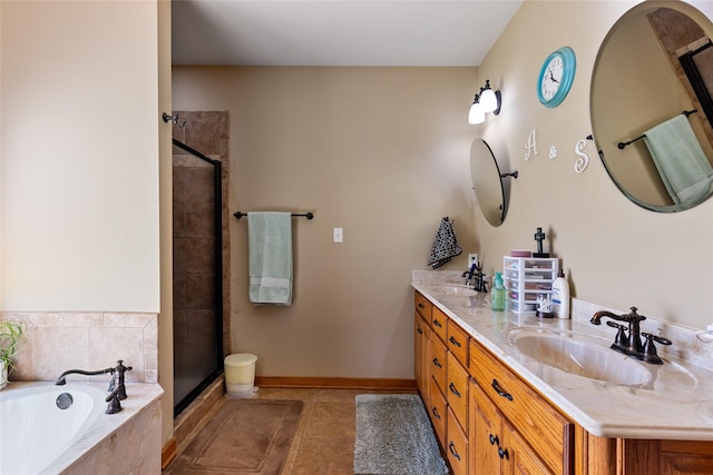 bathroom with a bath, tile patterned flooring, a stall shower, and a sink