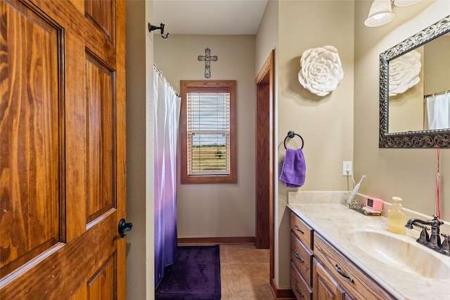 full bathroom featuring vanity and tile patterned flooring