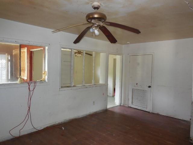 empty room featuring a ceiling fan and wood finished floors