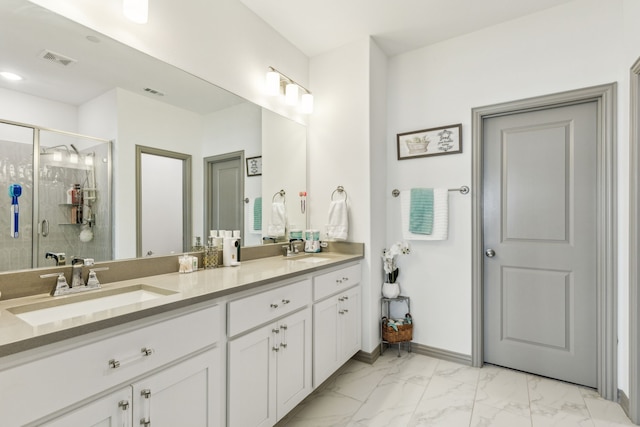 full bath with a shower stall, marble finish floor, a sink, and visible vents