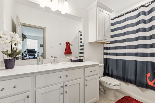 full bathroom with tile patterned floors, shower / bath combo with shower curtain, vanity, and toilet