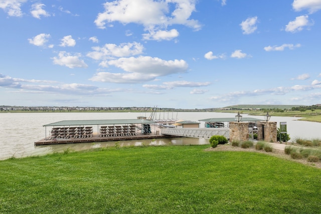 view of dock featuring a yard and a water view
