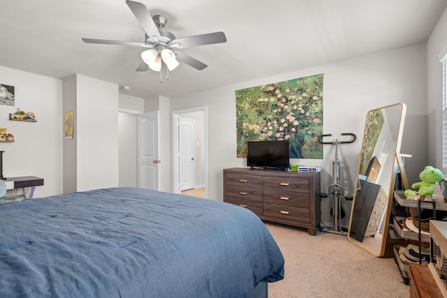 bedroom with a ceiling fan and light colored carpet