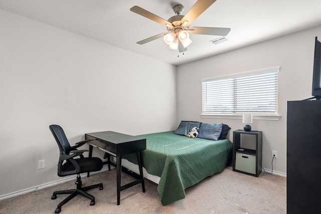 bedroom featuring carpet floors, visible vents, baseboards, and ceiling fan