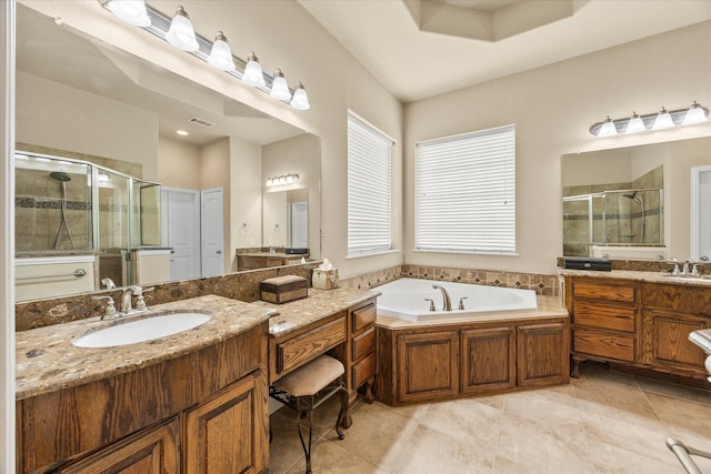 902 Alfred Dr, Wylie, TX 75098 - full bath featuring a stall shower, a bath, two vanities, and tile patterned floors