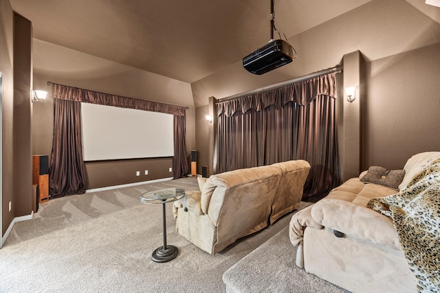 carpeted home theater room featuring baseboards