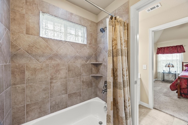 full bath featuring visible vents, tile patterned floors, baseboards, and shower / bath combo with shower curtain