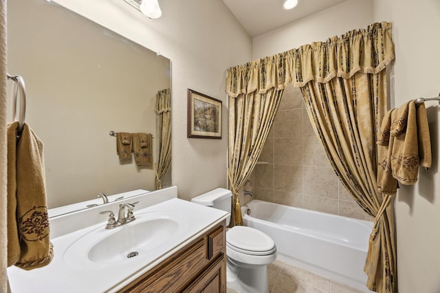 bathroom with vanity, tile patterned flooring, shower / bath combination with curtain, and toilet