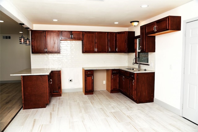 4841 Bromfield St, Dallas, TX 75216 - kitchen with recessed lighting, visible vents, a sink, pendant lighting, and decorative backsplash