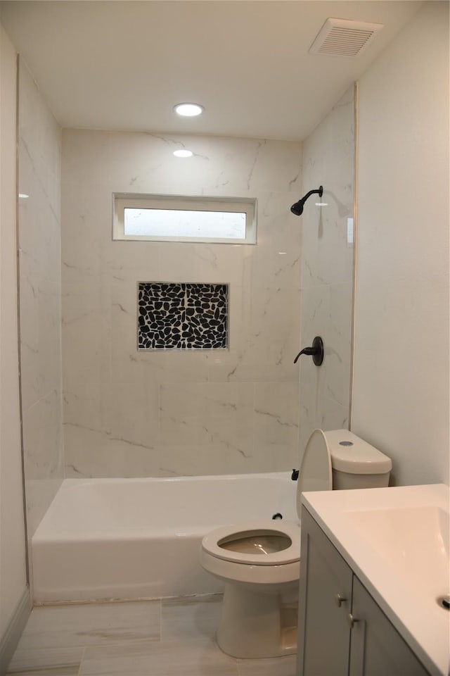 4841 Bromfield St, Dallas, TX 75216 - full bath featuring visible vents, toilet, vanity, and bathing tub / shower combination