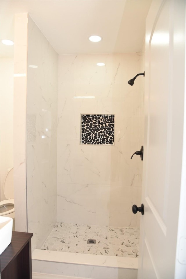 4841 Bromfield St, Dallas, TX 75216 - full bathroom featuring vanity, recessed lighting, and tiled shower
